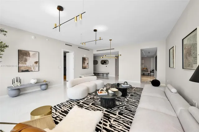 a bedroom with furniture or couch and a chandelier