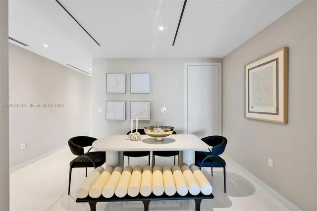 a dining room with furniture and window