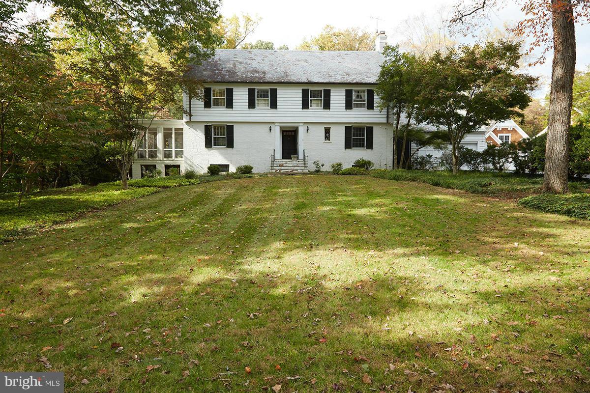 9108 Burning Tree Road Bethesda, MD 20817 - Photo 2 of 15 a front view of a house with a garden
