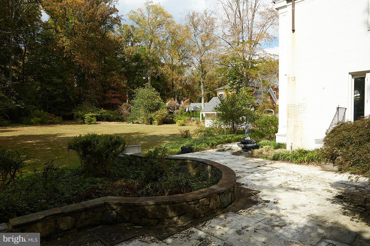 9108 Burning Tree Road Bethesda, MD 20817 - Photo 6 of 15 a view of a backyard with plants and lake view