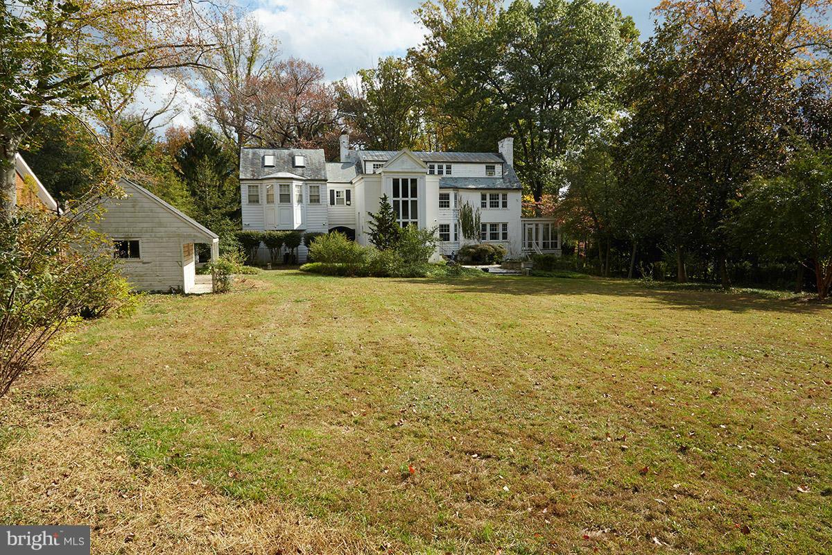 9108 Burning Tree Road Bethesda, MD 20817 - Photo 10 of 15 a view of a house with pool and trees