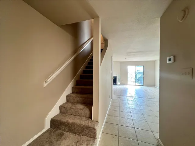 a view of entryway and hall with a window