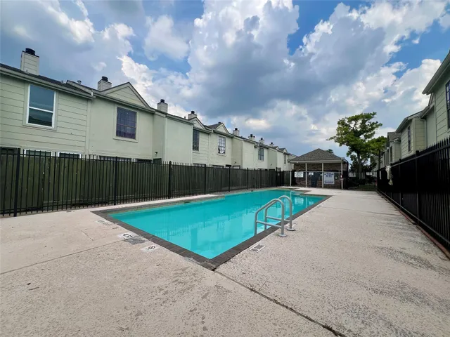 a view of a yard with cars park
