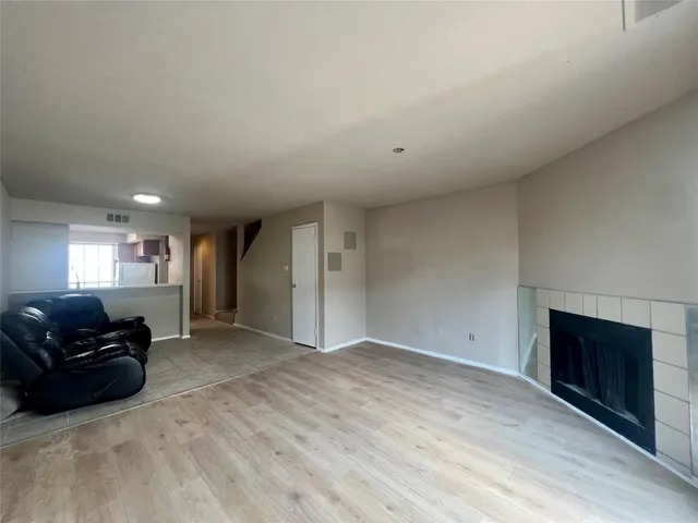 a view of a livingroom with furniture and a fireplace