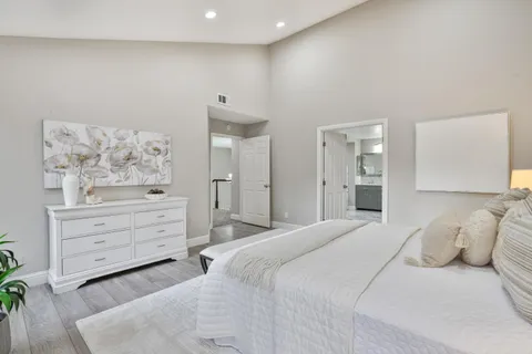 a bathroom with a granite countertop sink a mirror and a shower