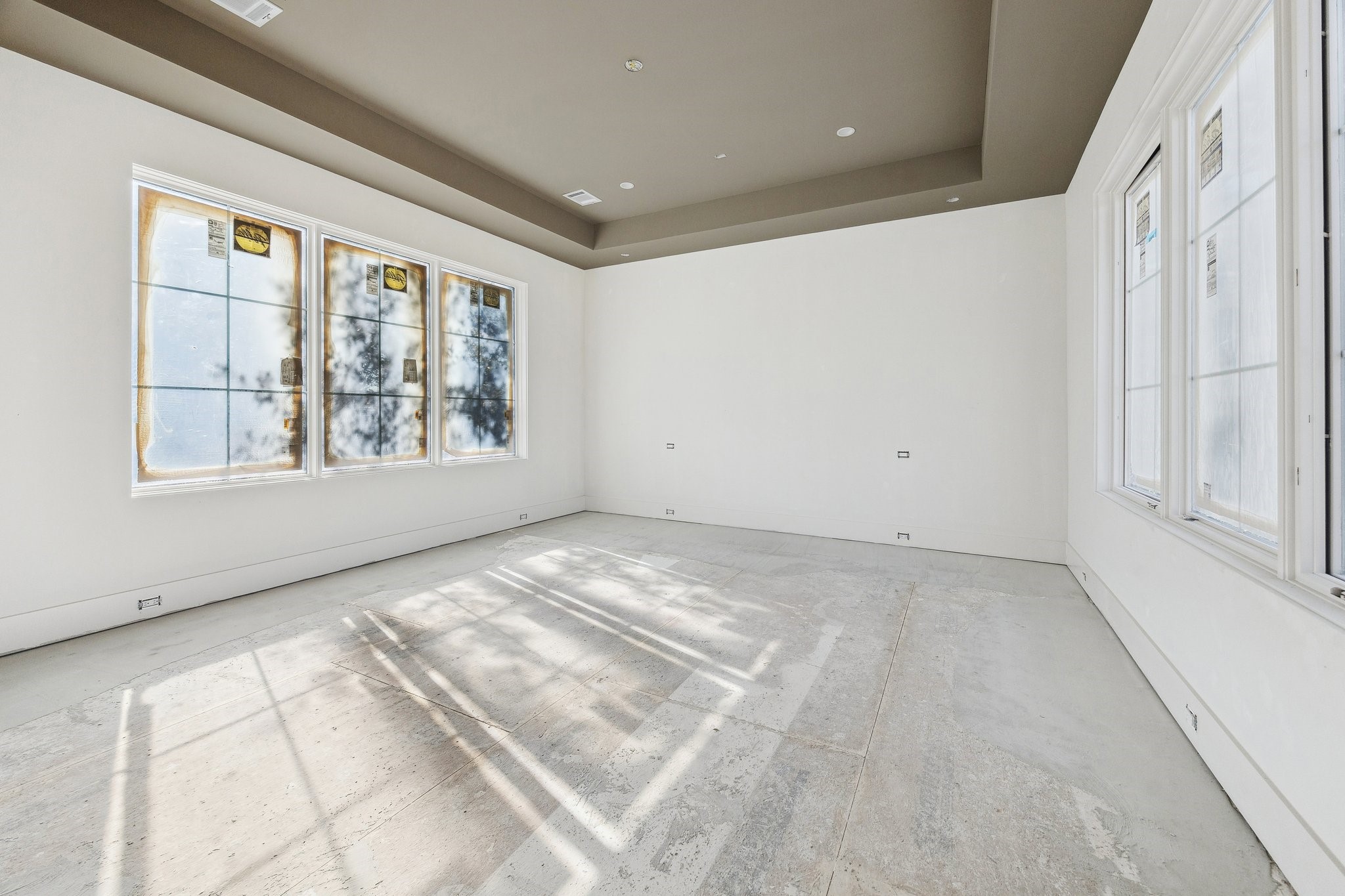 4152 Coleridge Street West University Place, TX 77005 - Photo 14 of 29 Primary Bedroom with a Coffered Ceiling. There are windows on each side of the room.