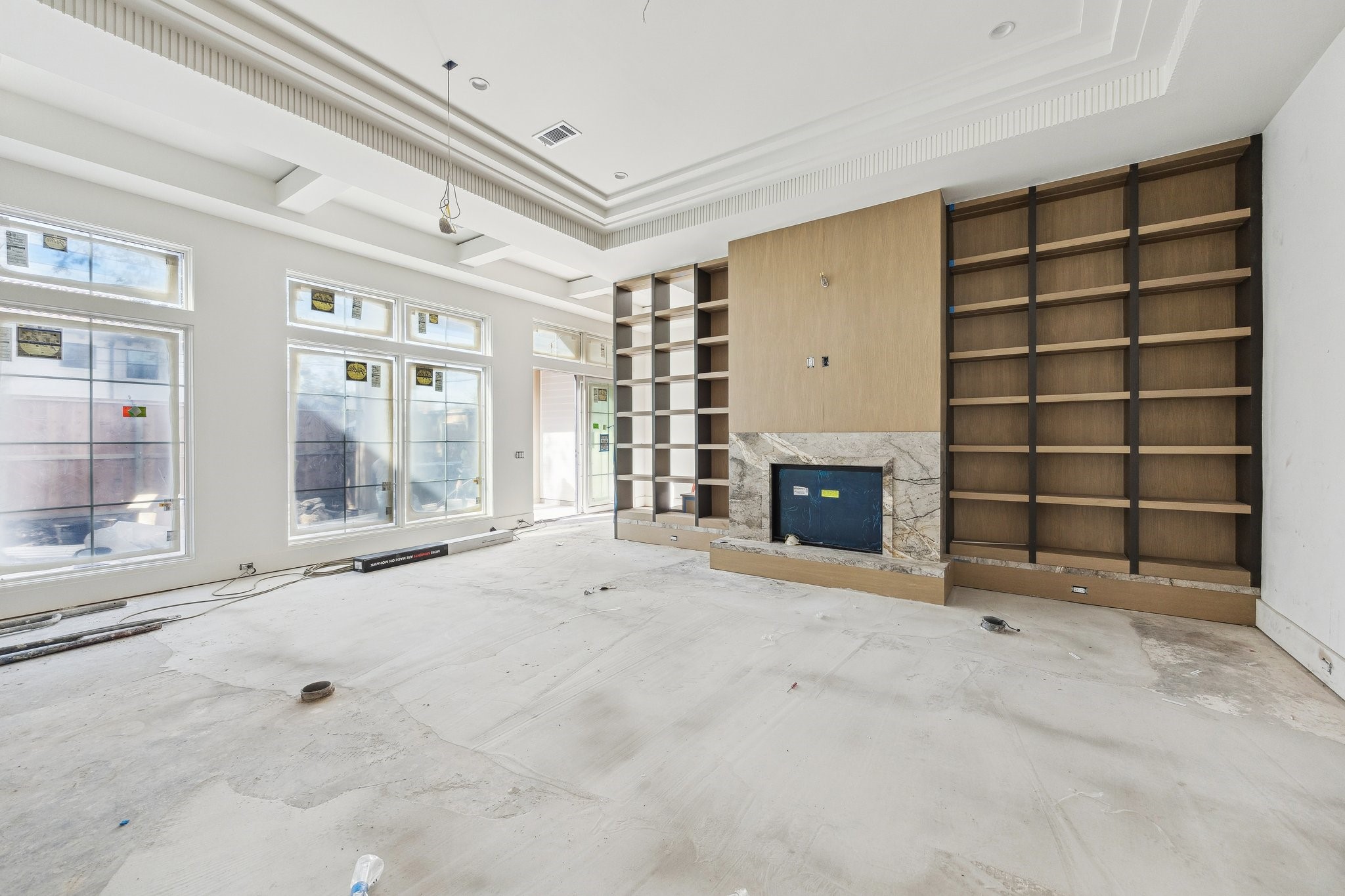 4152 Coleridge Street West University Place, TX 77005 - Photo 8 of 29 Family Room with a Direct Vent Fireplace and Built-in Shelves with White Oak back Panels. There is a stone hearth and stain grade panels the entire length of the wall.