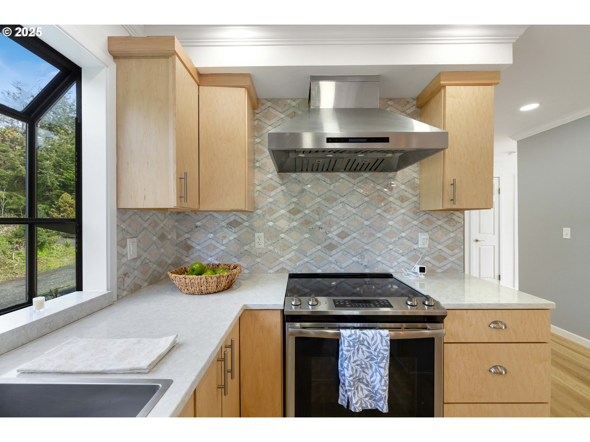66599 Quail Road North Bend, OR 97459 - Photo 11 of 45 a kitchen with stainless steel appliances granite countertop a sink stove and cabinets