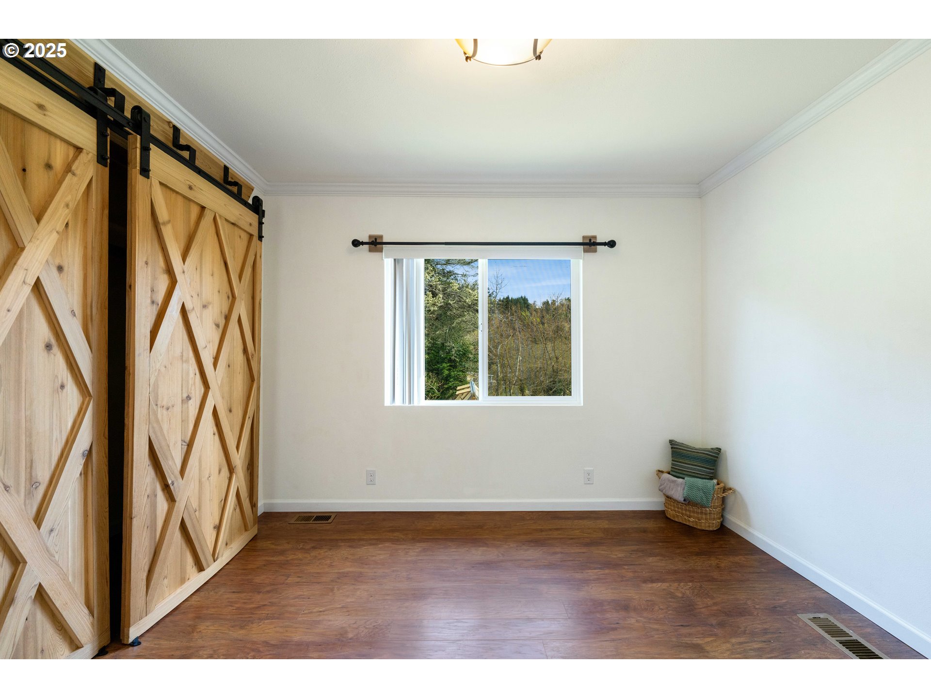 66599 Quail Road North Bend, OR 97459 - Photo 22 of 45 a view of an empty room with a window