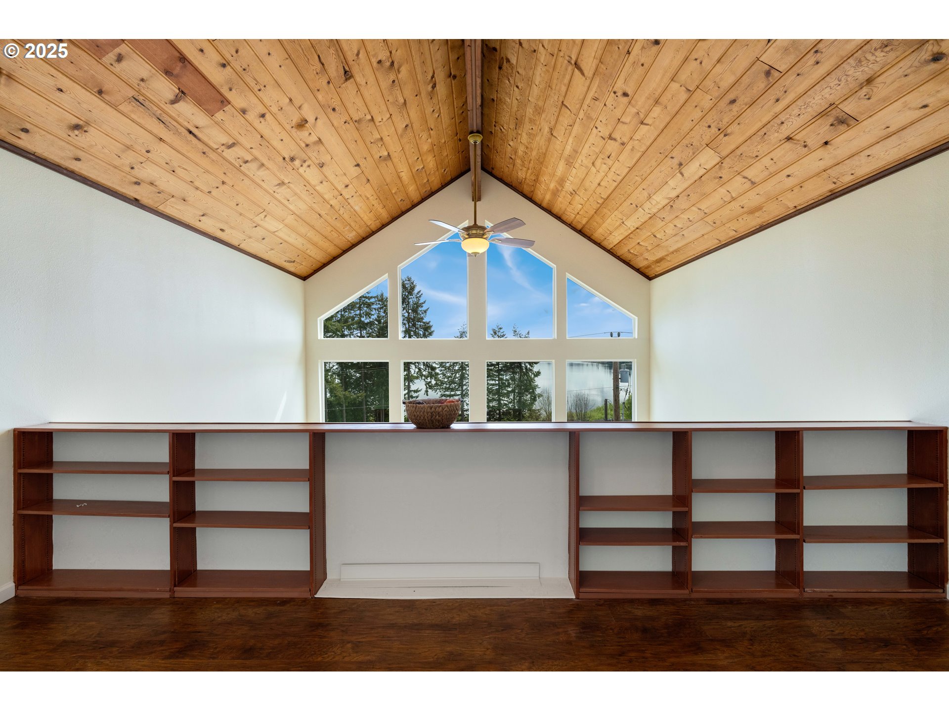 66599 Quail Road North Bend, OR 97459 - Photo 27 of 45 a view of a room with a window and a ceiling fan