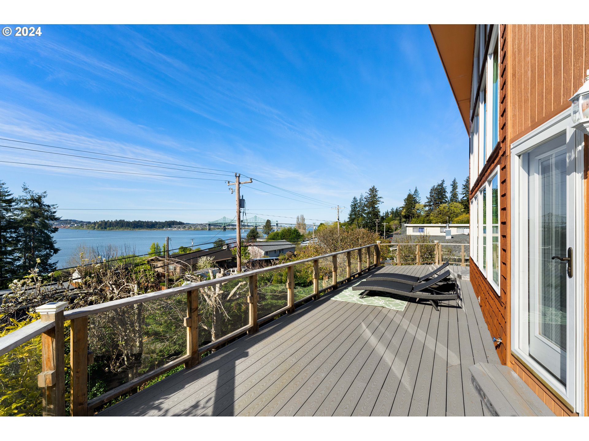 66599 Quail Road North Bend, OR 97459 - Photo 37 of 45 a view of balcony with two chairs and wooden floor