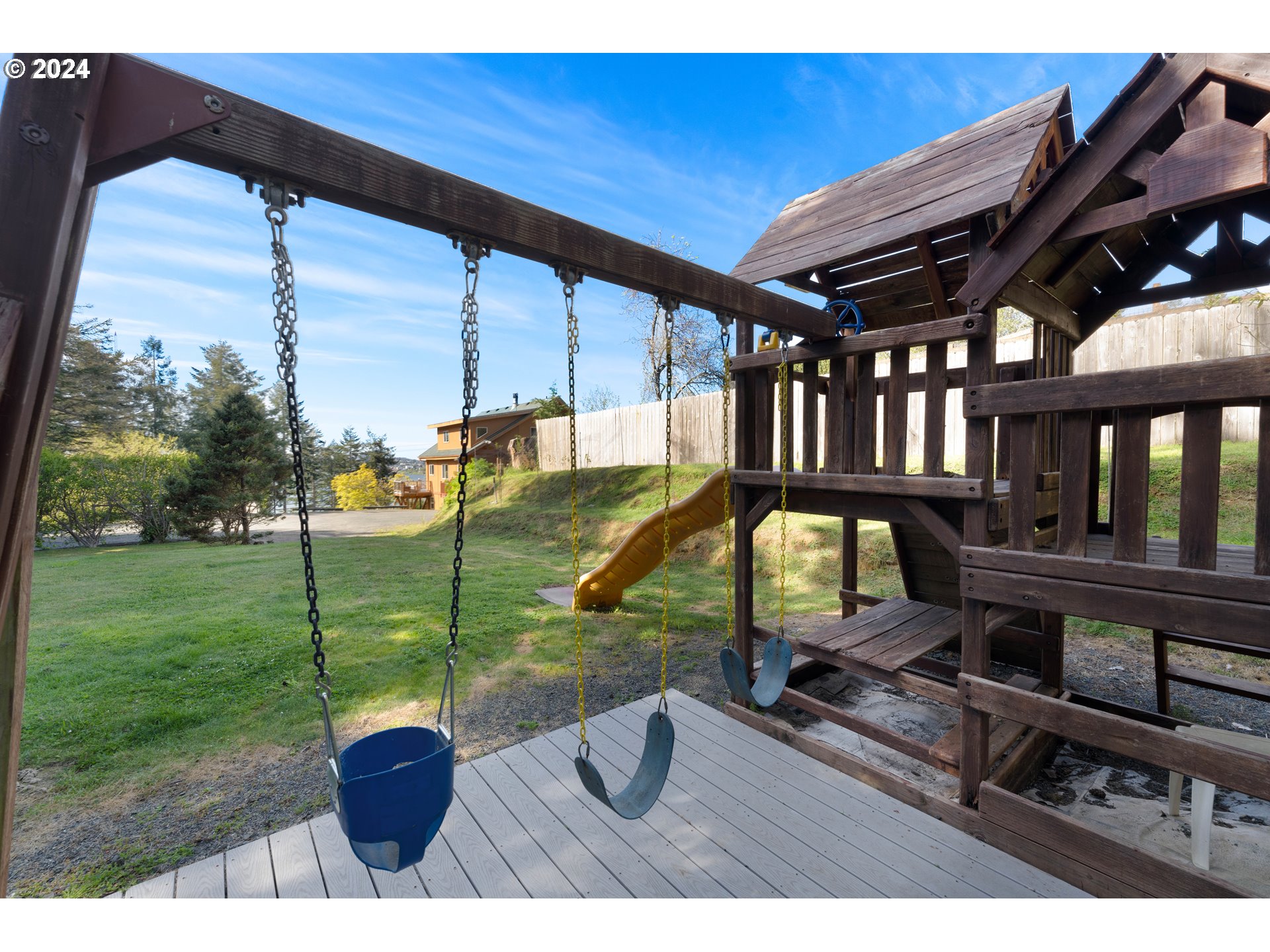66599 Quail Road North Bend, OR 97459 - Photo 42 of 45 a view of a porch with chairs and a yard