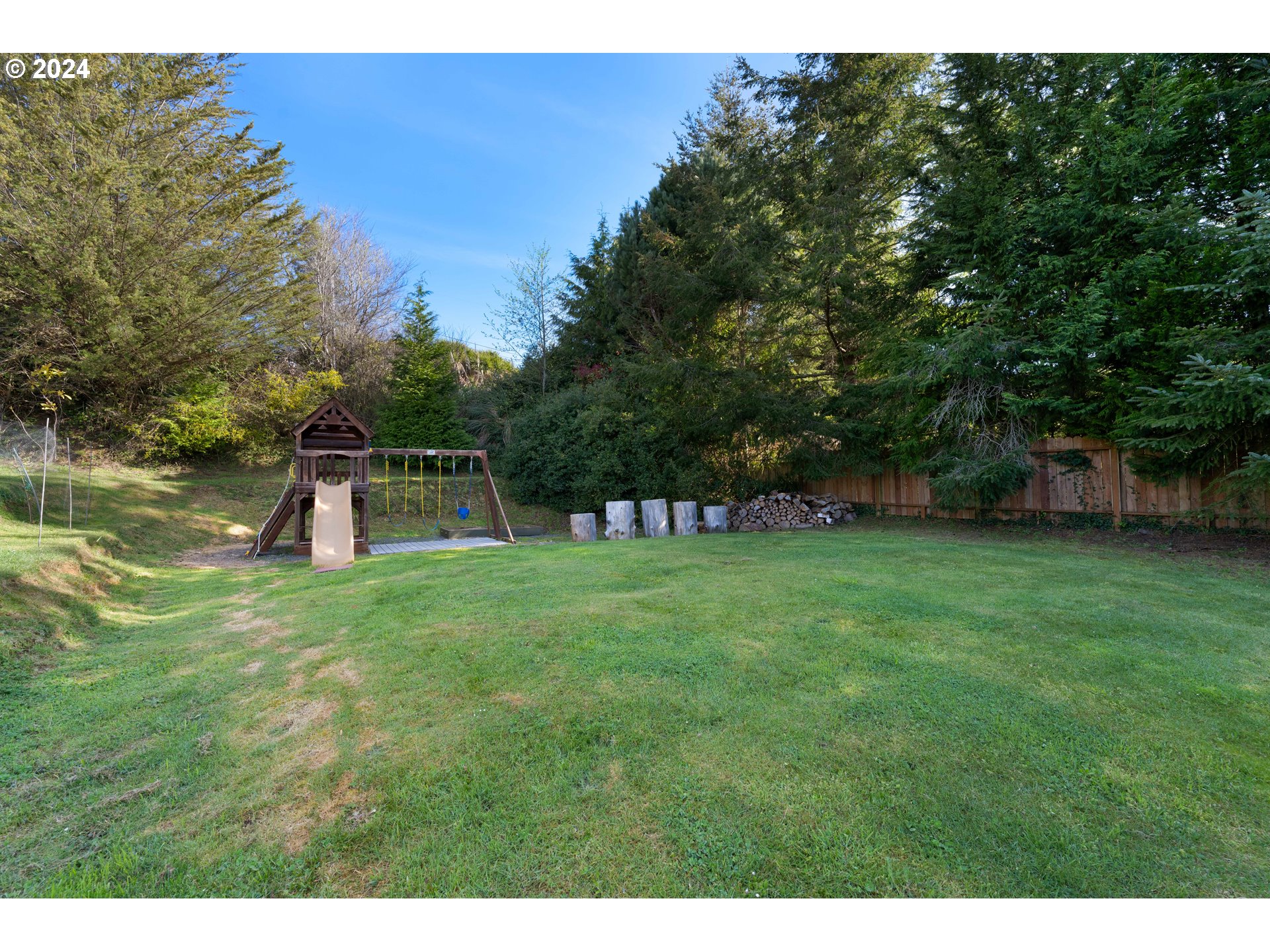 66599 Quail Road North Bend, OR 97459 - Photo 43 of 45 a front view of a house with a yard