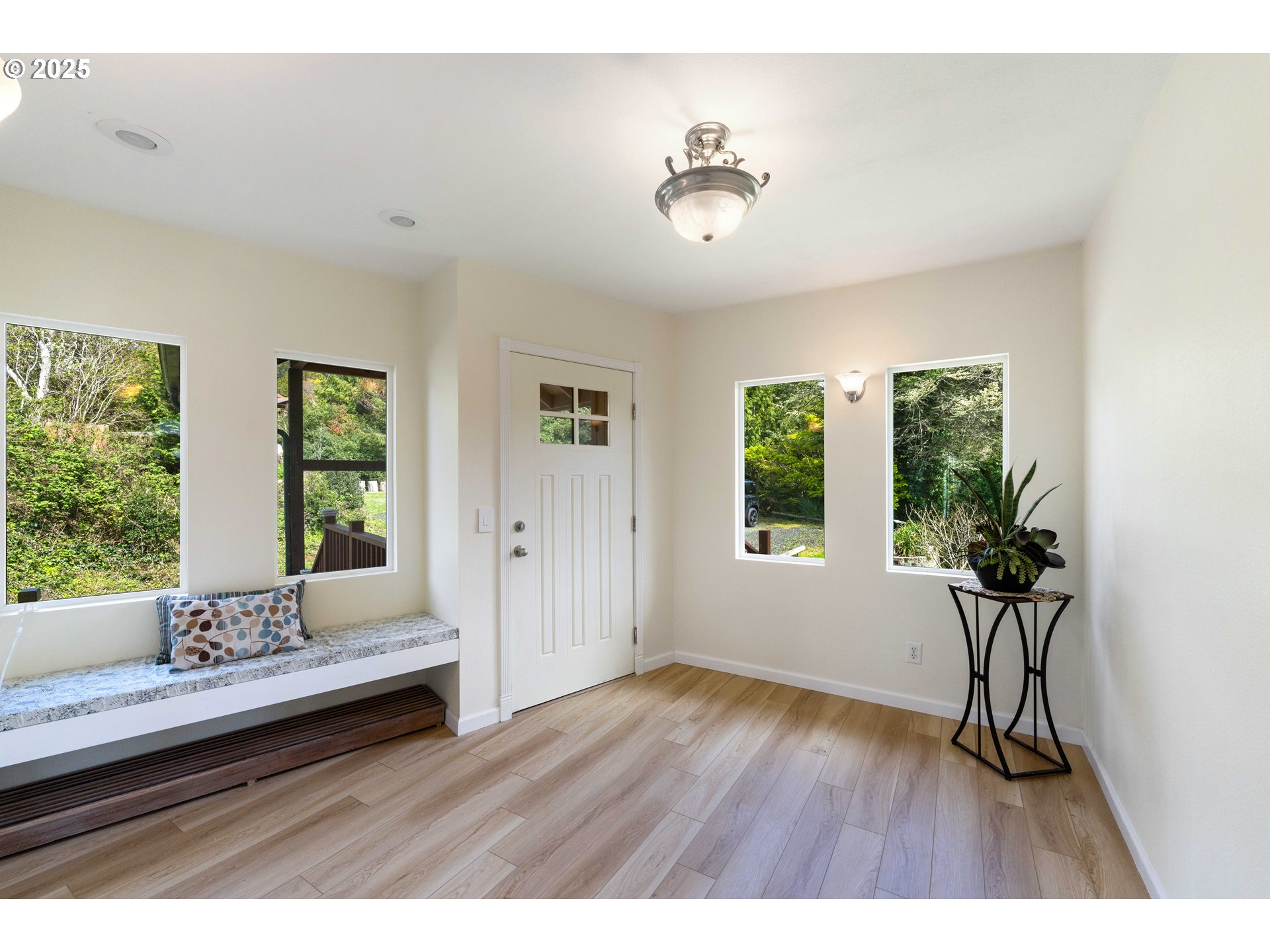 66599 Quail Road North Bend, OR 97459 - Photo 5 of 45 a living room with furniture and a large window
