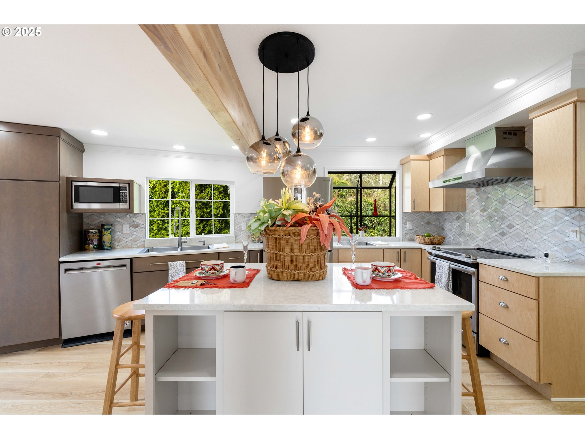 66599 Quail Road North Bend, OR 97459 - Photo 6 of 45 a kitchen with kitchen island granite countertop a sink cabinets and window