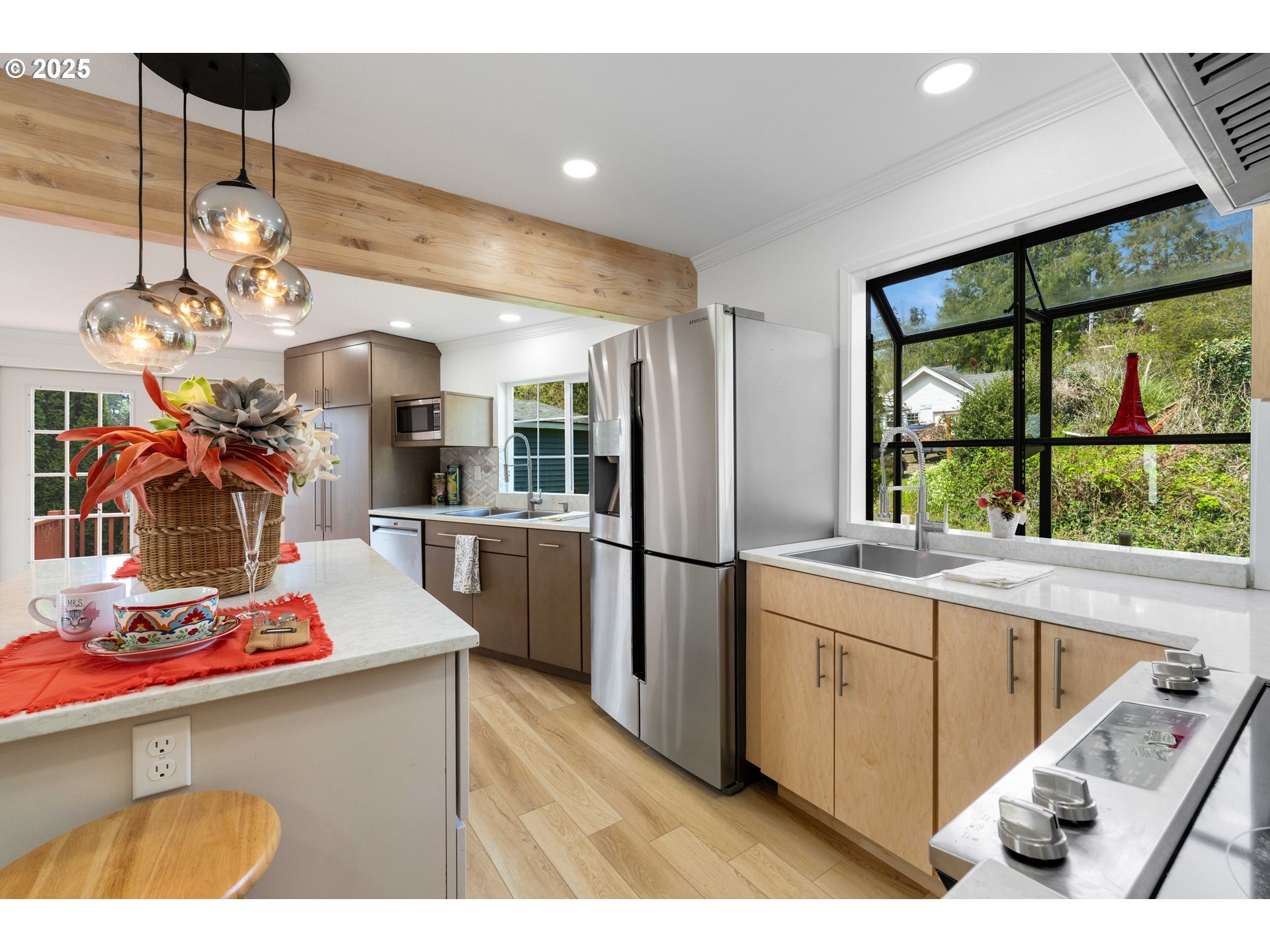 66599 Quail Road North Bend, OR 97459 - Photo 7 of 45 a kitchen with stainless steel appliances kitchen island granite countertop a sink and cabinets
