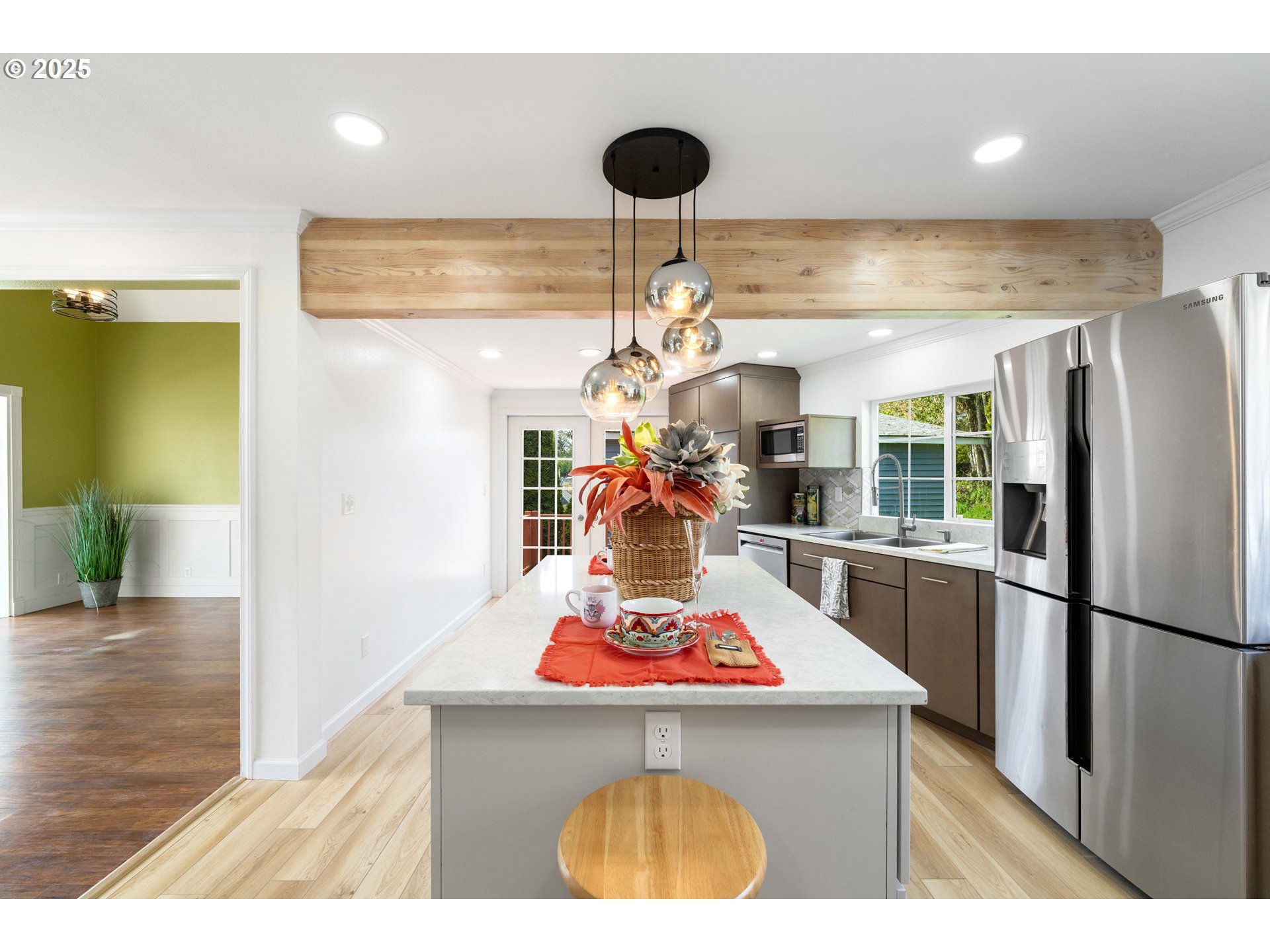 66599 Quail Road North Bend, OR 97459 - Photo 8 of 45 a kitchen with a refrigerator a stove and a dining table