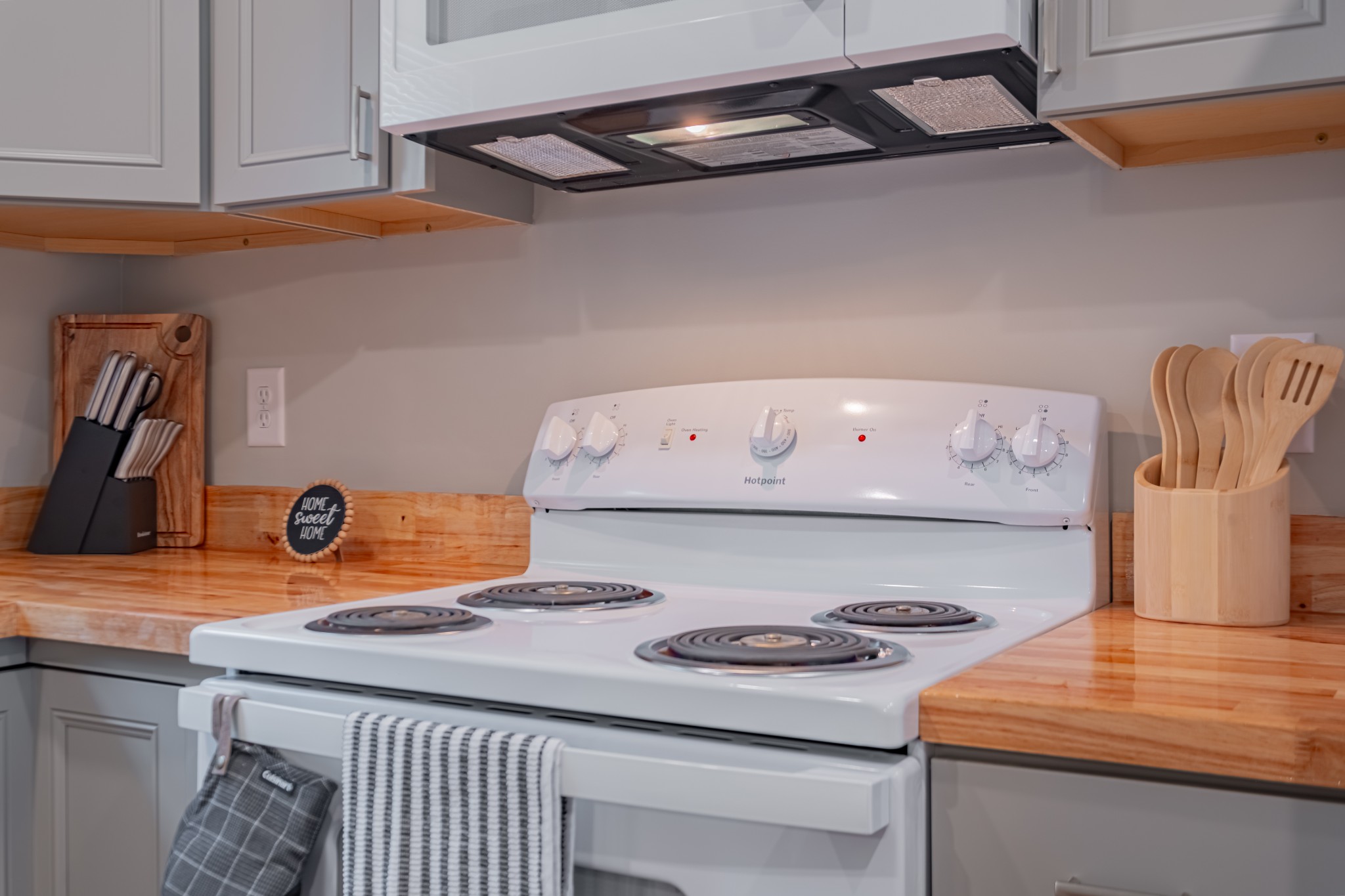 3481 Normandy Road Normandy, TN 37360 - Photo 13 of 27 a kitchen with a stove a microwave and cabinets