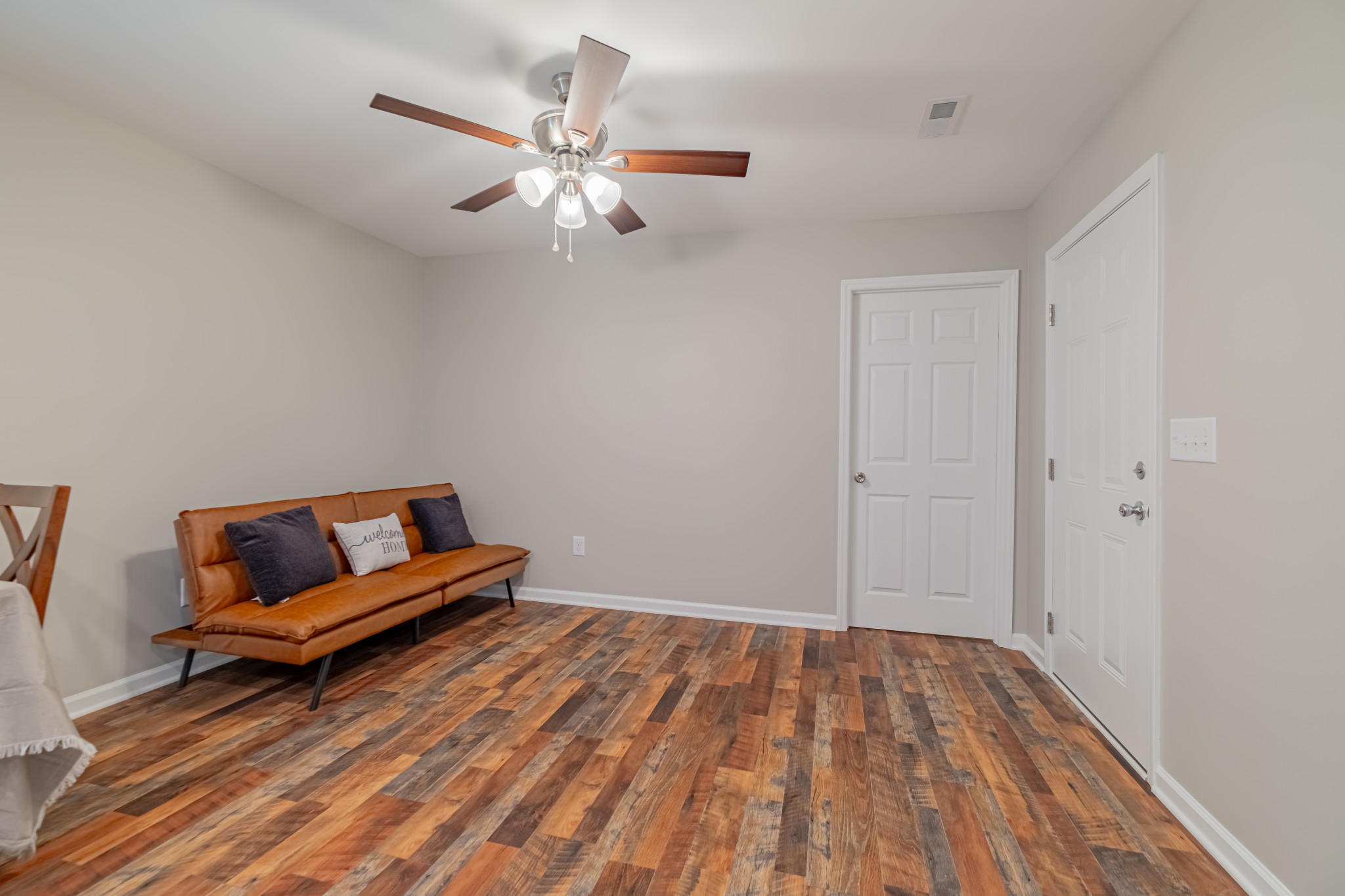 3481 Normandy Road Normandy, TN 37360 - Photo 17 of 27 an empty room with wooden floor and ceiling fan