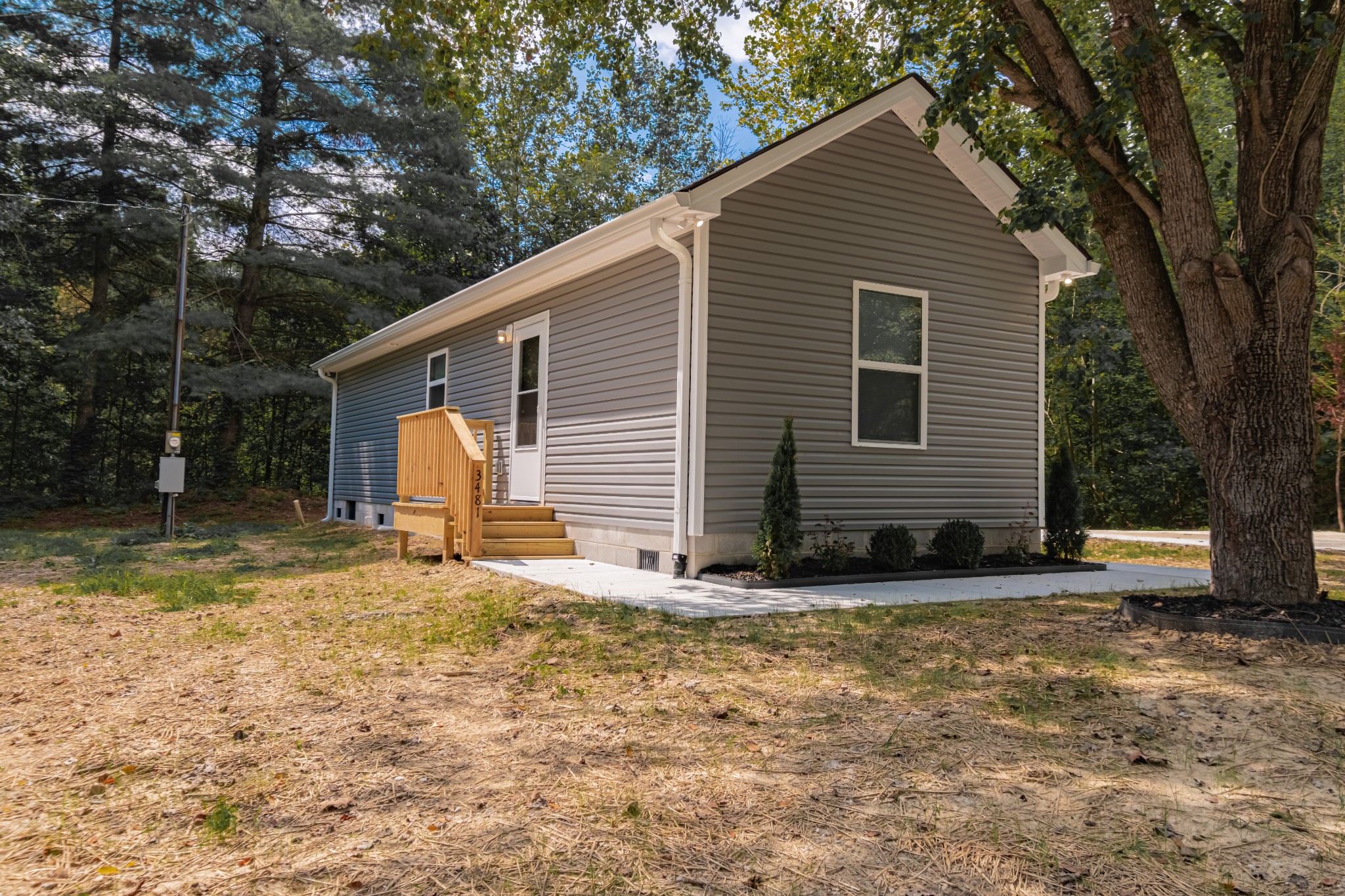 3481 Normandy Road Normandy, TN 37360 - Photo 2 of 27 a view of a house with backyard and trees