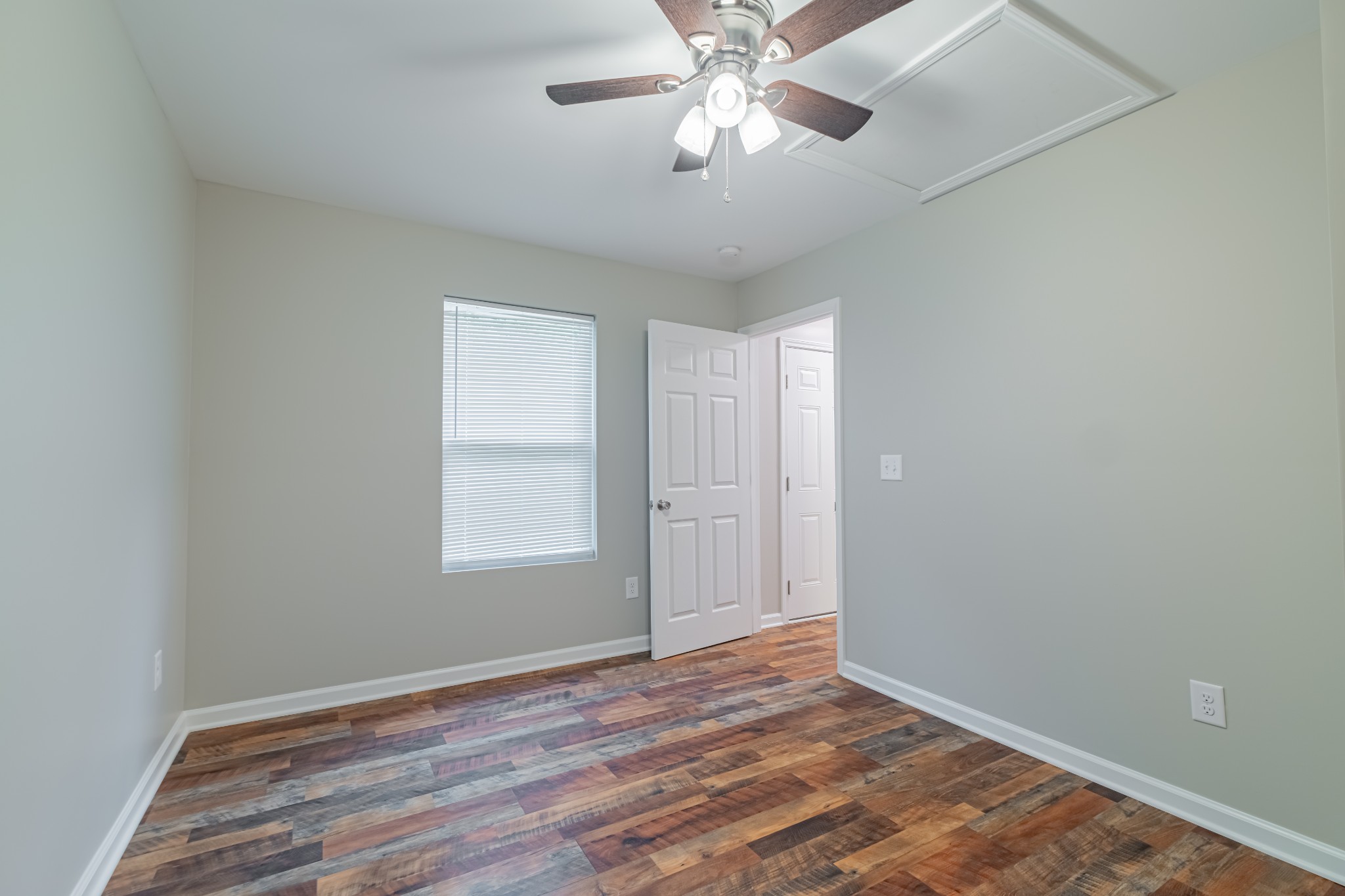 3481 Normandy Road Normandy, TN 37360 - Photo 24 of 27 a view of an empty room with wooden floor and a window