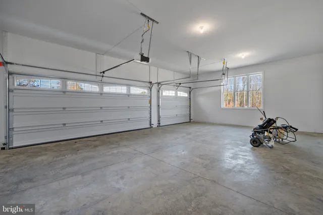 a room with a dresser and a window