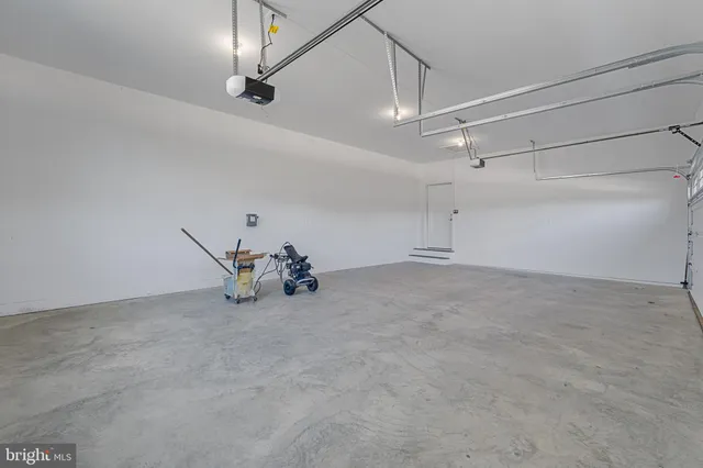 an empty room with ceiling fan