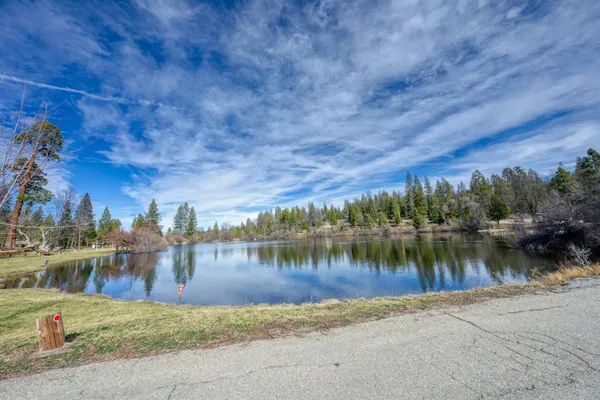 a view of a lake with houses in the background