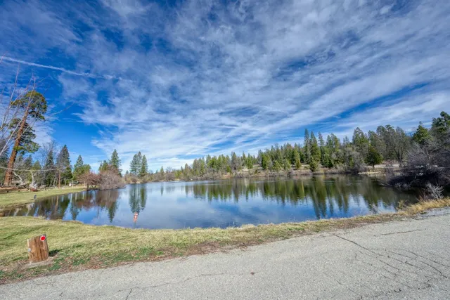 a view of a lake with houses in the background