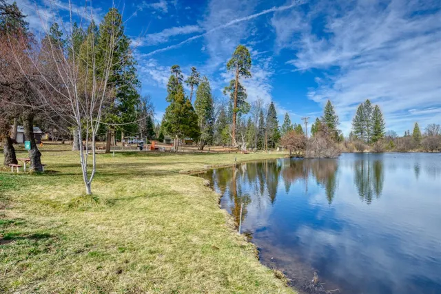 a view of a lake with houses in the back