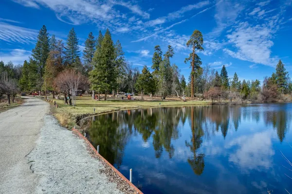 a view of a lake with houses in outdoor space