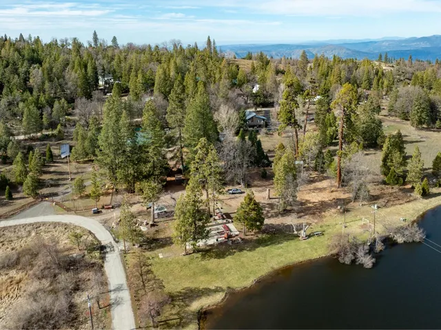a view of a lake with trees