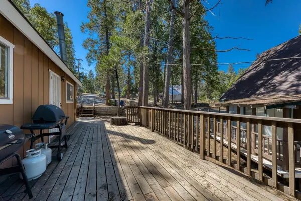 a view of balcony with furniture and wooden deck
