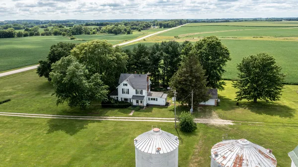 a view of a swimming pool and a yard