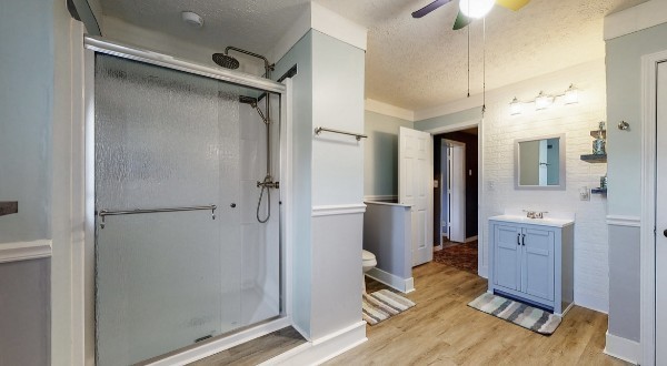 419 East Main Street Red Boiling Springs, TN 37150 - Photo 33 of 44 a spacious bathroom with a shower sink and mirror