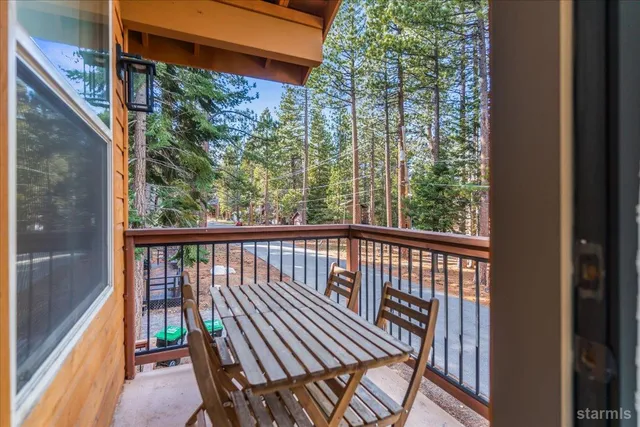 a view of balcony with wooden floor