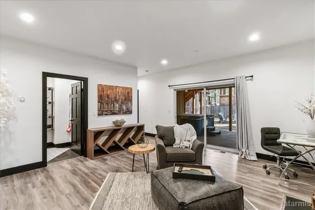 a living room with furniture a window and a table