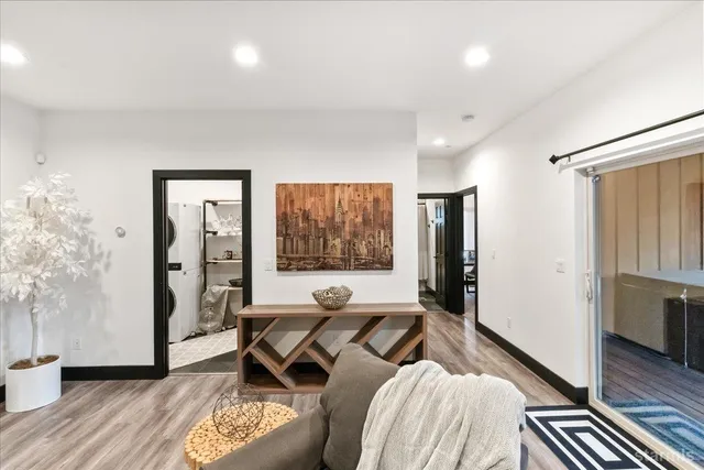 a living room with furniture window and wooden floor