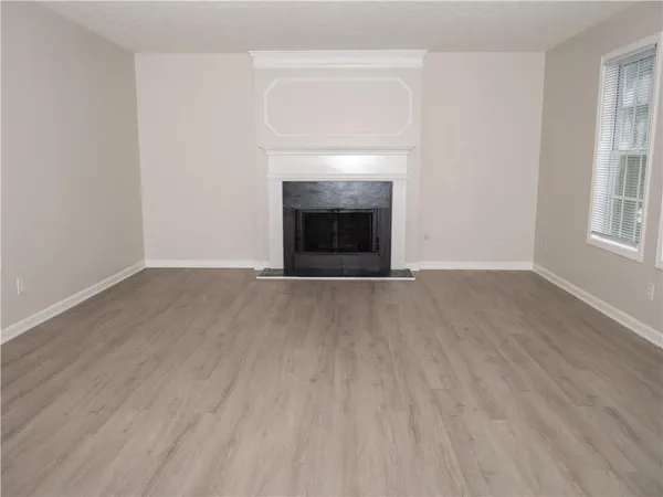 a view of cabinets and wooden floor