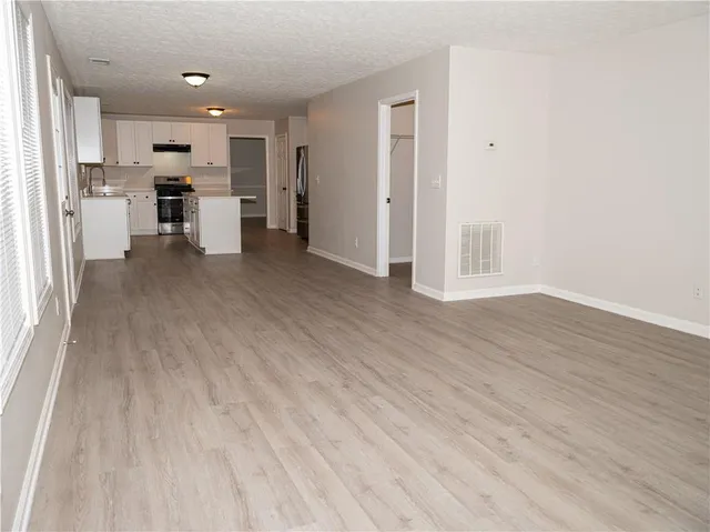 a view of cabinets and wooden floor