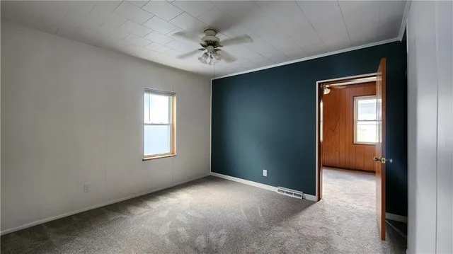 an empty room with a empty space and windows