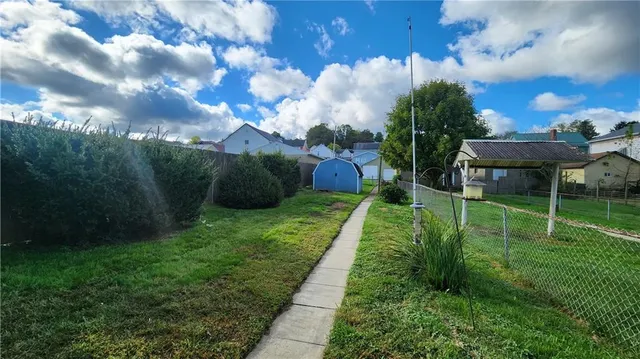 a view of a garden with a bench