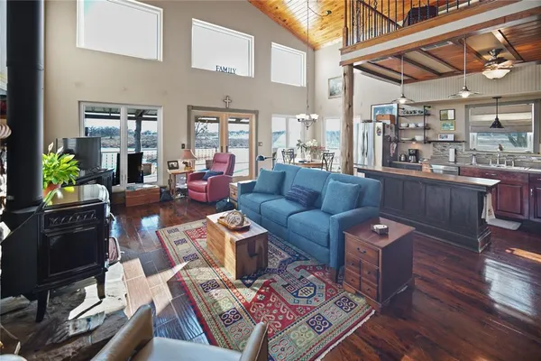 a living room with furniture a fireplace and a table
