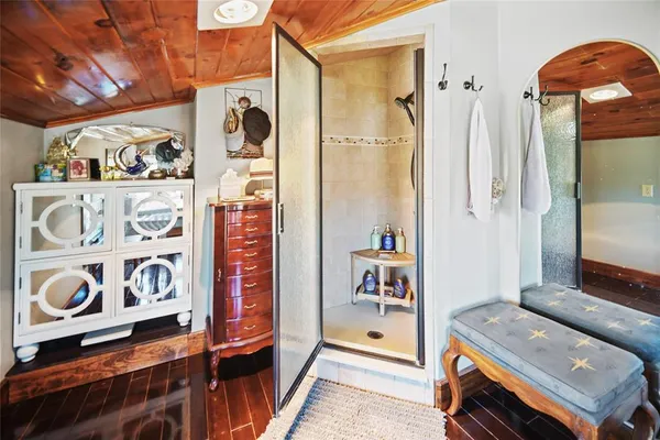 a view of an entryway with wooden floor