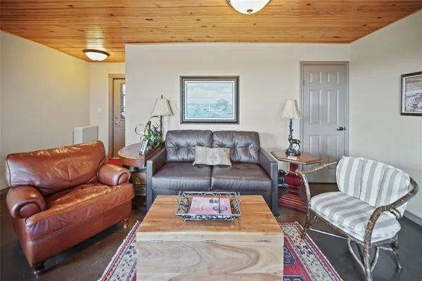 a living room with furniture and a rug