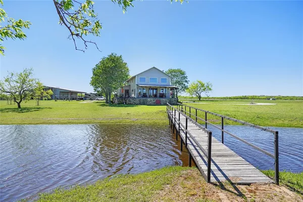 a view of a swimming pool with a yard
