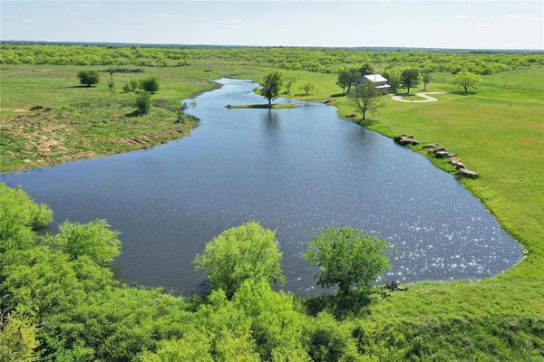 a view of a lake with a yard
