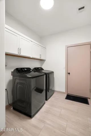 a utility room with washer and dryer