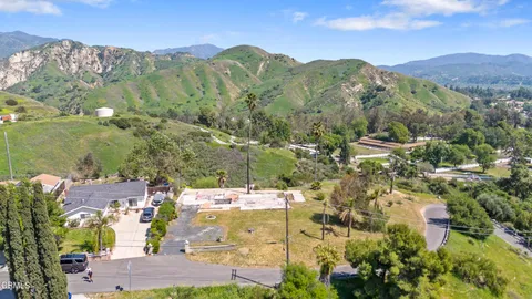 an aerial view of residential house and green space