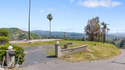 a view of a swimming pool with a chairs